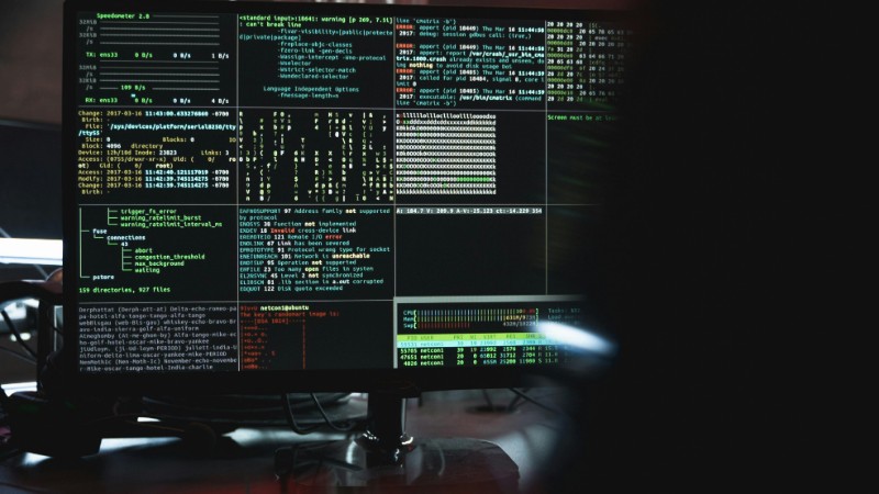 Close-up of a computer monitor displaying cyber security data and code, indicative of system hacking or programming., tags: daten - pexel